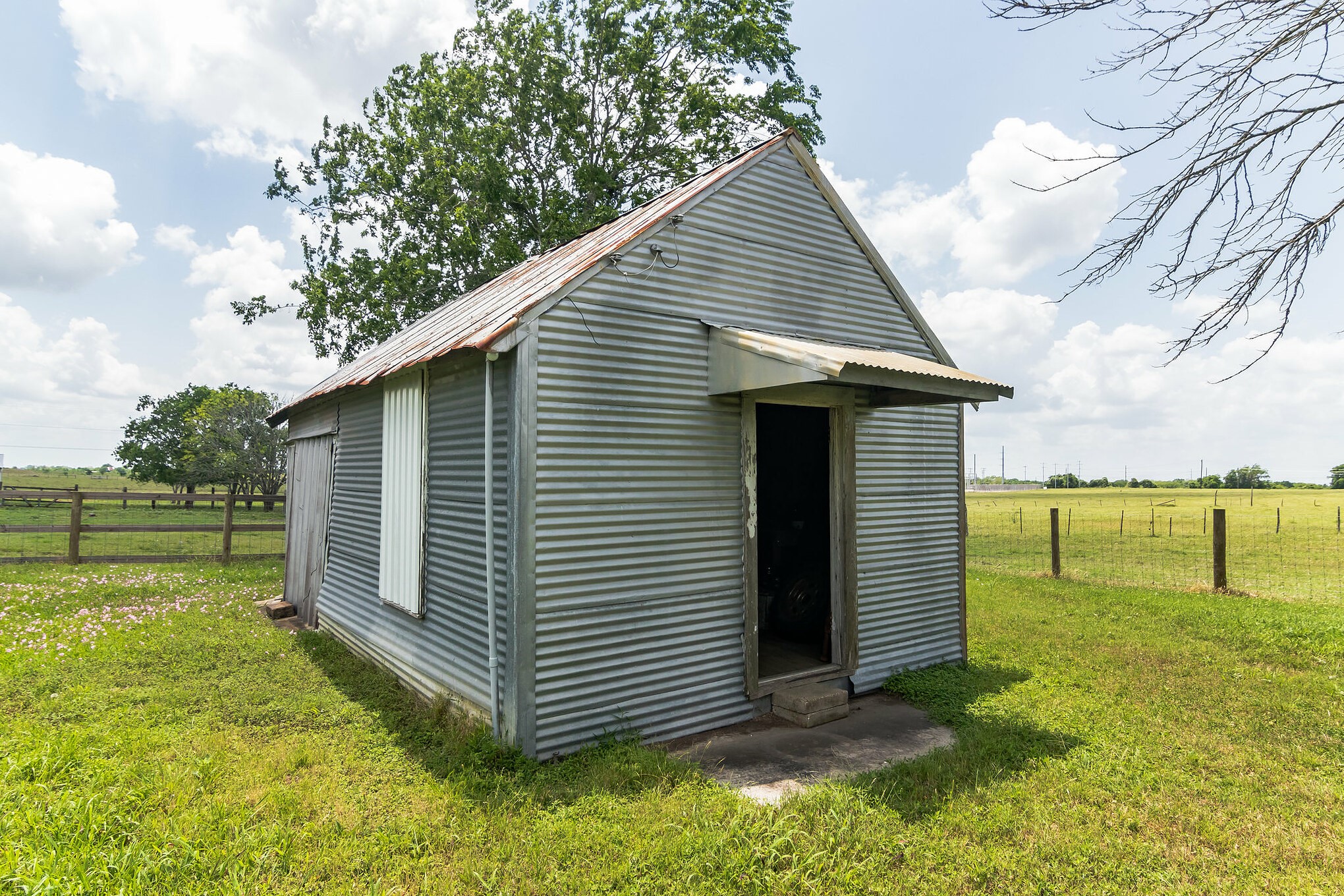 1230 FM 155 Weimar, TX 78962 - Photo 22 of 27 a view of a backyard with a large tree