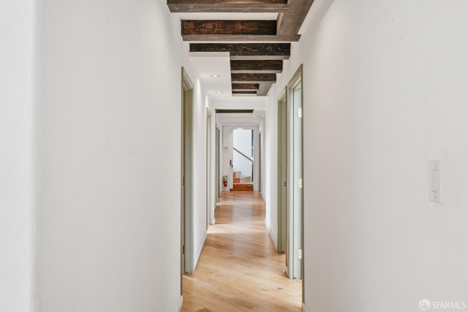 335 South Van Ness Avenue San Francisco, CA 94103 - Photo 13 of 17 a view of a hallway with wooden floor and entryway