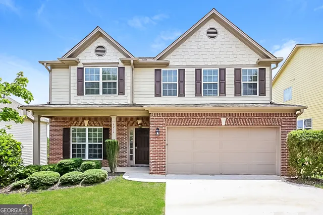 front view of a house with a yard