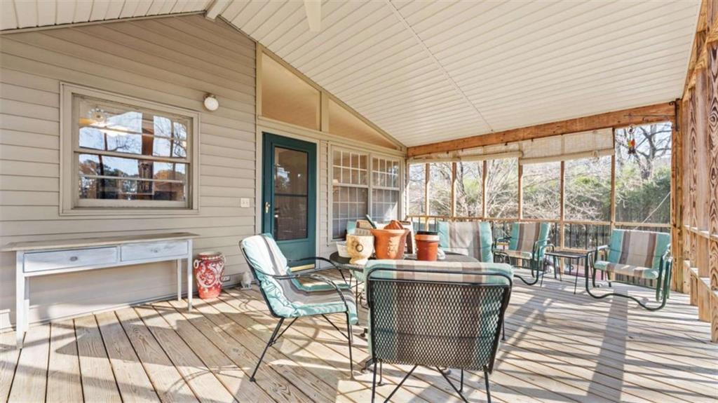 8 Lakemoore Drive Northeast Rome, GA 30161 - Photo 12 of 44 a living room filled with furniture and large windows