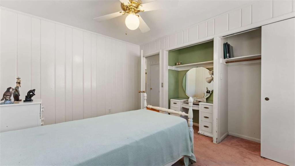 8 Lakemoore Drive Northeast Rome, GA 30161 - Photo 17 of 44 a bedroom with a bed and a chandelier