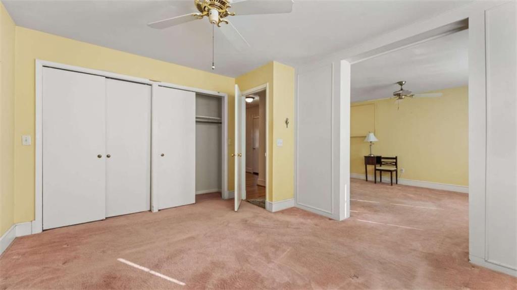 8 Lakemoore Drive Northeast Rome, GA 30161 - Photo 20 of 44 a view of a big room with closet and chandelier fan