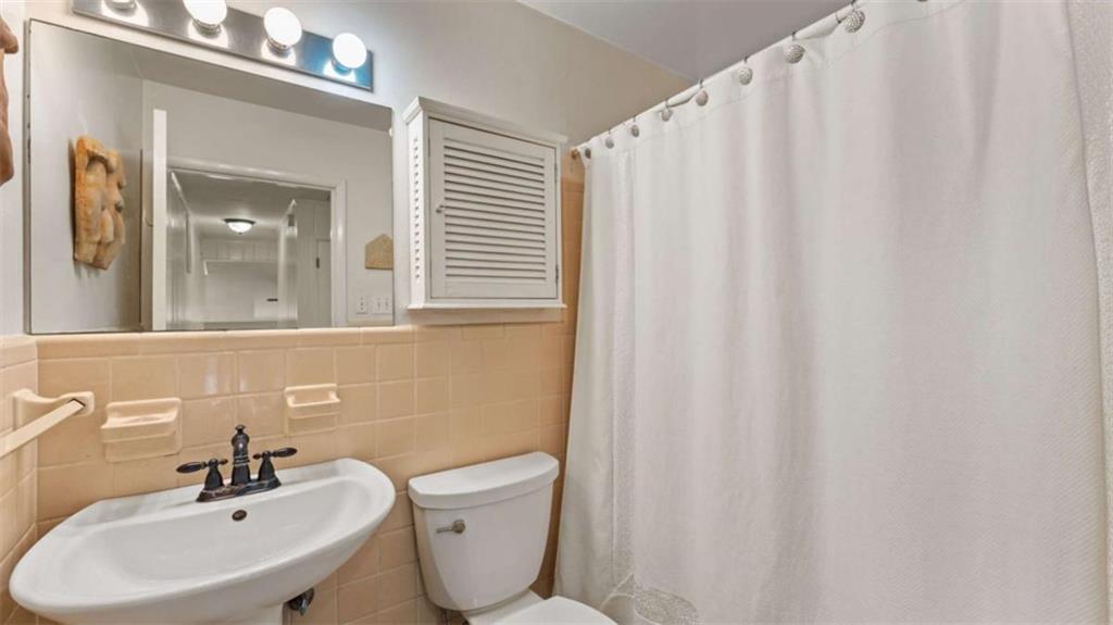 8 Lakemoore Drive Northeast Rome, GA 30161 - Photo 23 of 44 a bathroom with a sink a toilet and a mirror