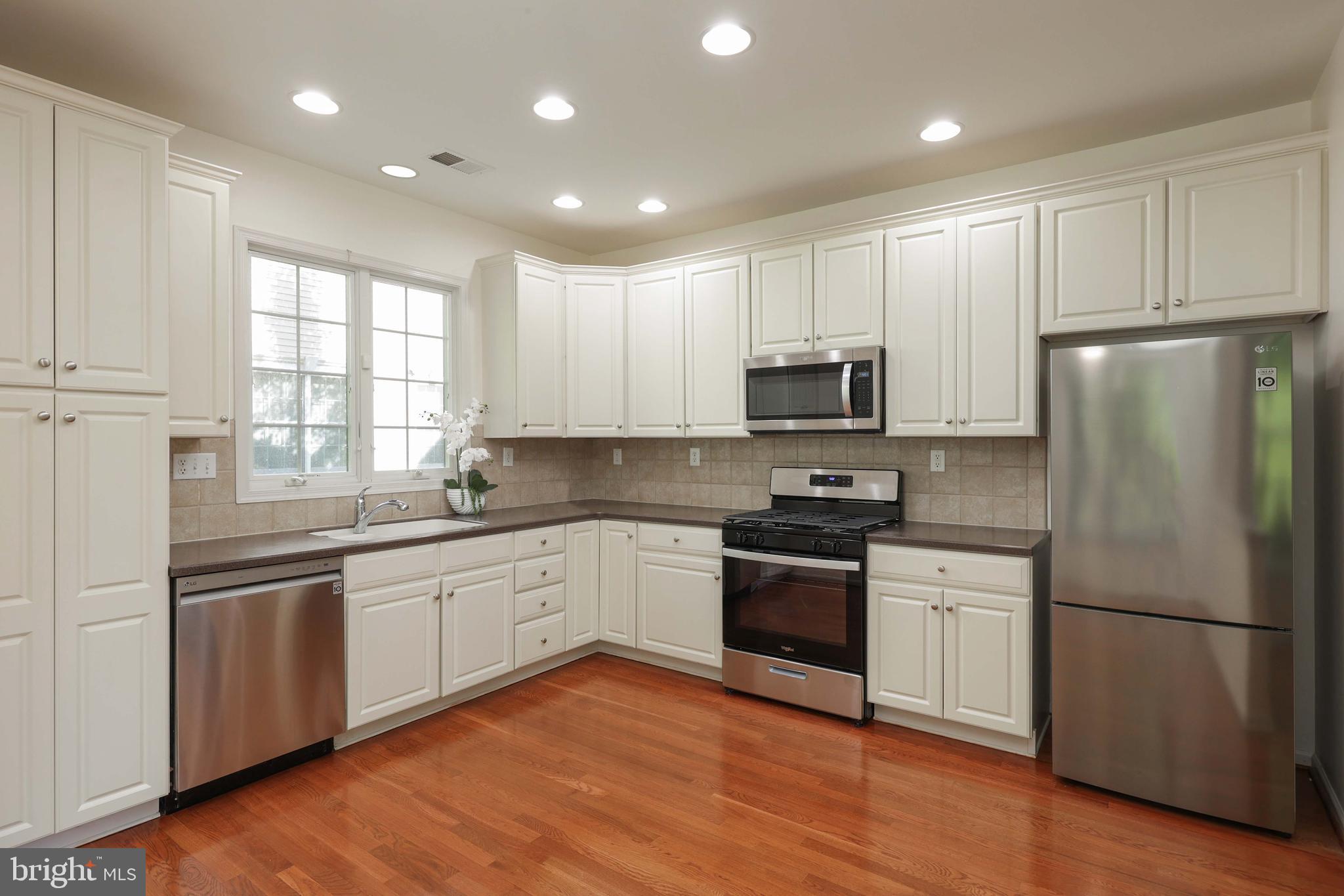 11 Wedgewood Court Princeton, NJ 08540 - Photo 13 of 40 a kitchen with granite countertop stainless steel appliances and wooden cabinets