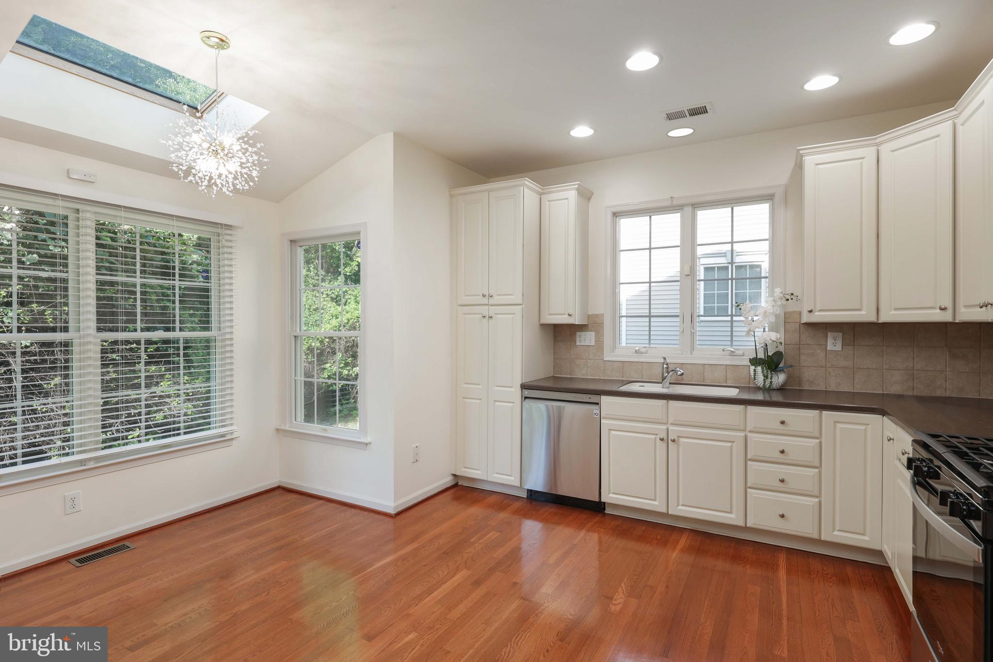 11 Wedgewood Court Princeton, NJ 08540 - Photo 14 of 40 a view of a kitchen with a sink wooden cabinets and a window