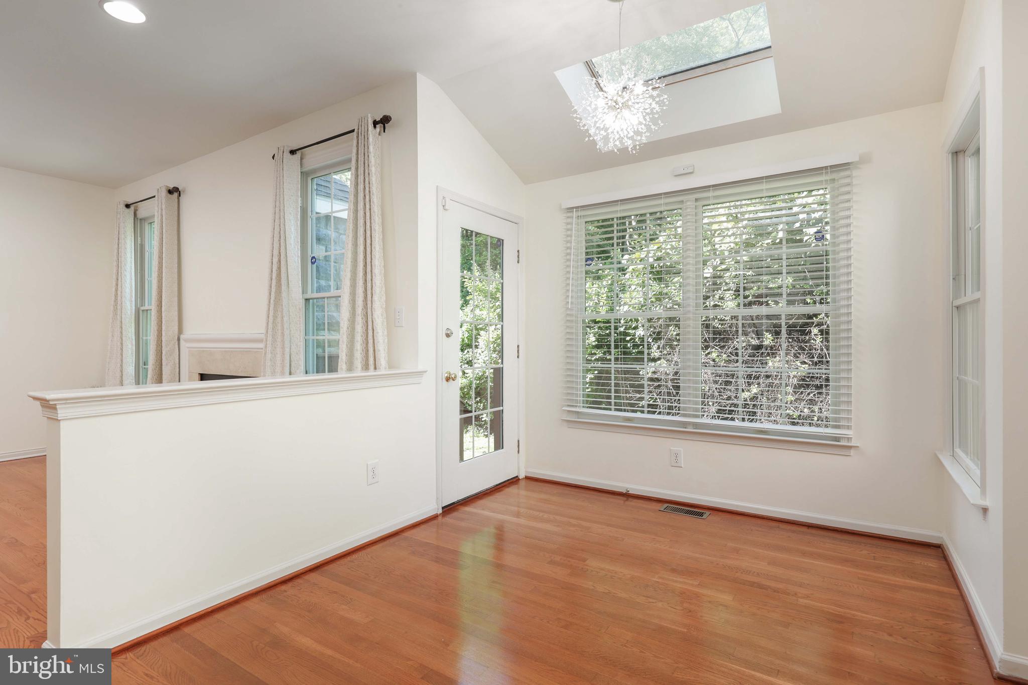 11 Wedgewood Court Princeton, NJ 08540 - Photo 19 of 40 a view of an empty room with a window and wooden floor