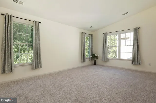 a bathroom with a granite countertop sink a toilet and a bathtub