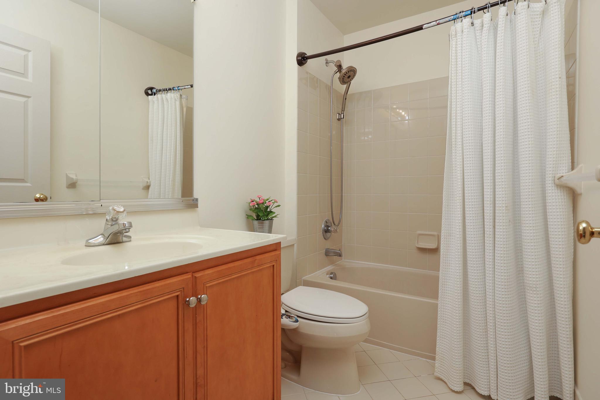 11 Wedgewood Court Princeton, NJ 08540 - Photo 26 of 40 a bathroom with a sink a toilet and shower