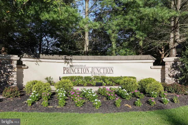 an aerial view of a house with pool lake view and mountain view