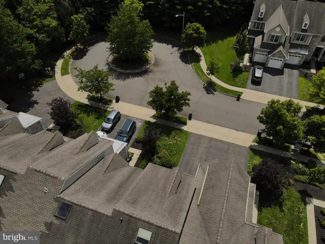 an aerial view of a house with yard
