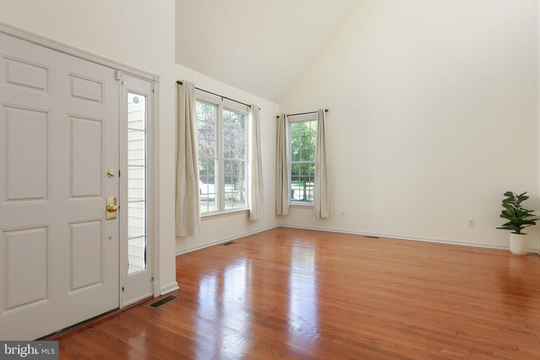 11 Wedgewood Court Princeton, NJ 08540 - Photo 4 of 40 a view of an empty room with wooden floor and a window