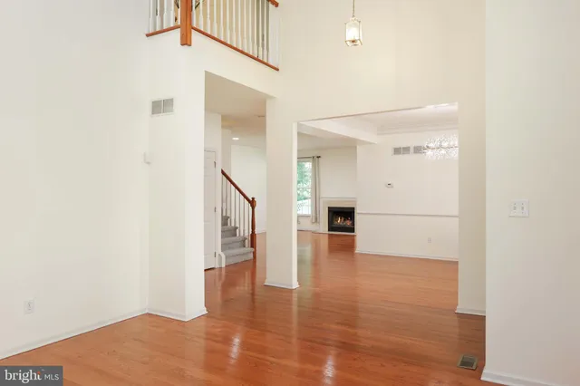 a view of an entryway with wooden floor
