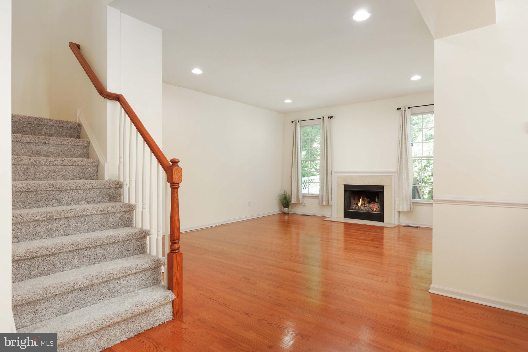 11 Wedgewood Court Princeton, NJ 08540 - Photo 10 of 40 a view of an empty room with wooden floor fireplace and a window