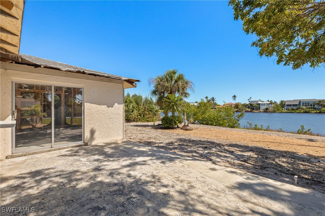 1457 Sand Castle Road Sanibel, FL 33957 - Photo 28 of 41 a view of a house with backyard and trees