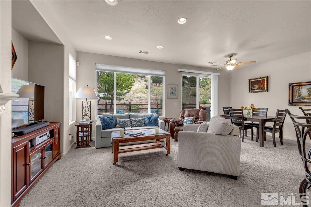 1205 Firefly Court Reno, NV 89523 - Photo 7 of 39 a living room with furniture and a flat screen tv