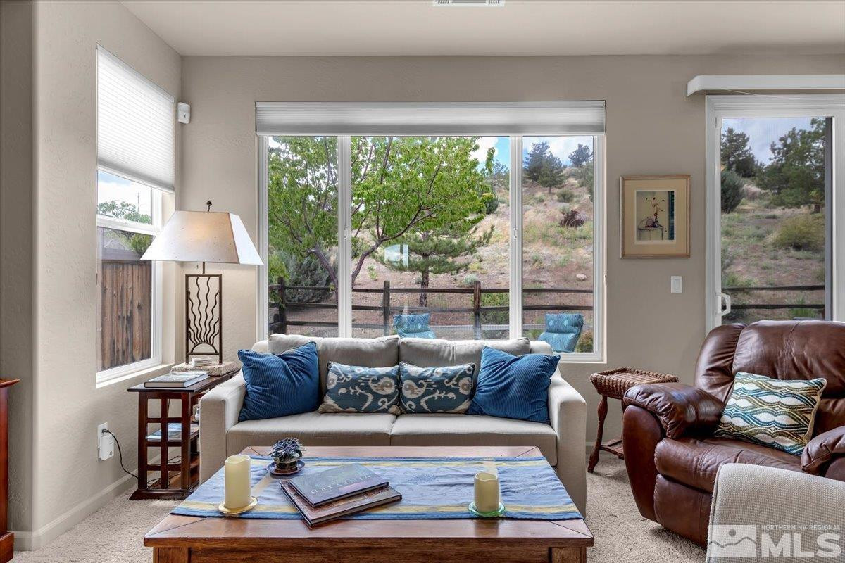 1205 Firefly Court Reno, NV 89523 - Photo 8 of 39 a living room with furniture and a large window