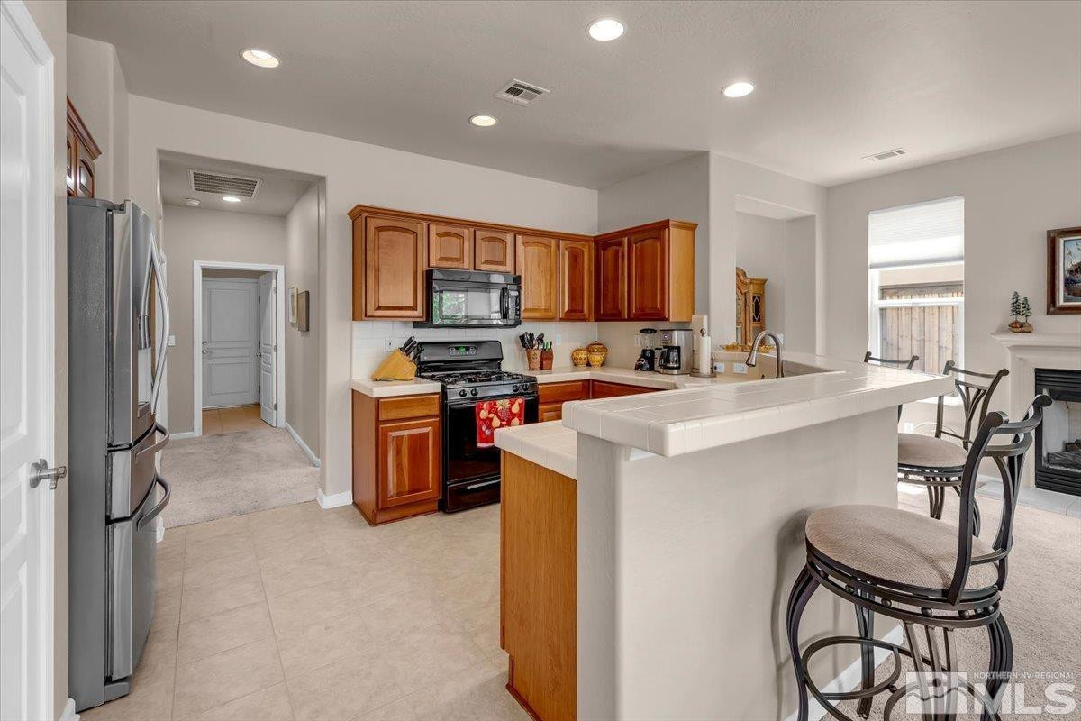 1205 Firefly Court Reno, NV 89523 - Photo 10 of 39 a kitchen with a sink appliances and cabinets