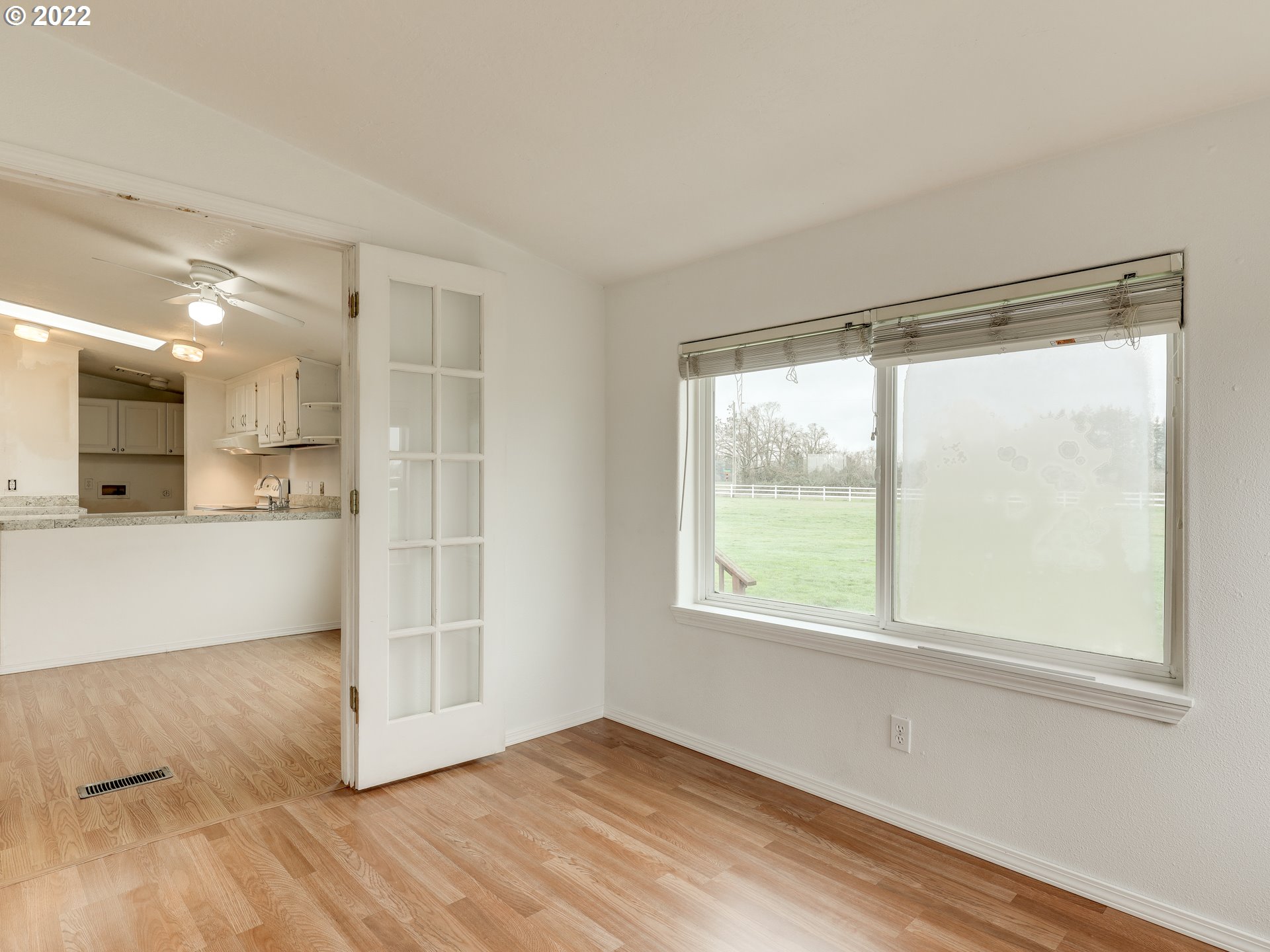 8489 South Gribble Road Canby, OR 97013 - Photo 17 of 32 a view of a big room with wooden floor and windows