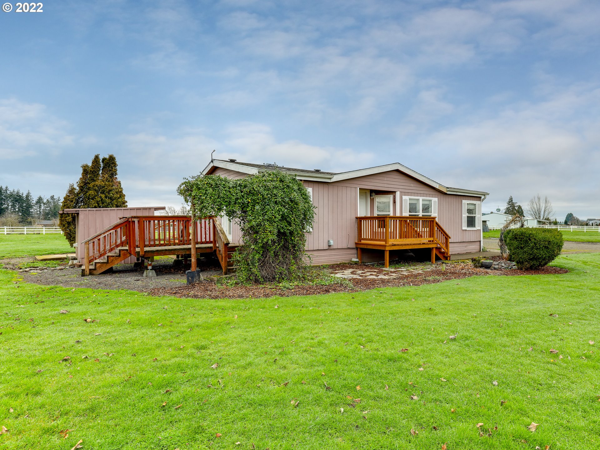 8489 South Gribble Road Canby, OR 97013 - Photo 2 of 32 a house view with a garden space