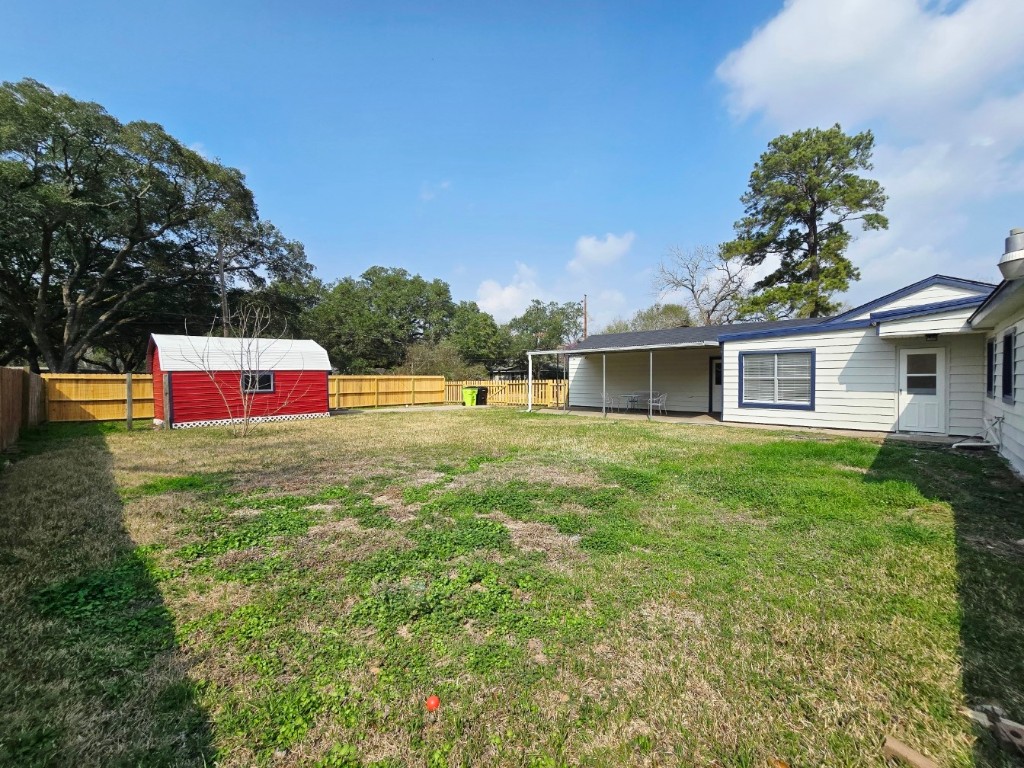 1300 Brazos Street Rosenberg, TX 77471 - Photo 20 of 22 Huge back yard with a out door storage