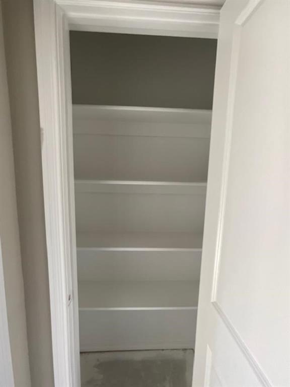 1203 Anthony Street Gainesville, TX 76240 - Photo 20 of 24 a view of walk in closet with empty racks