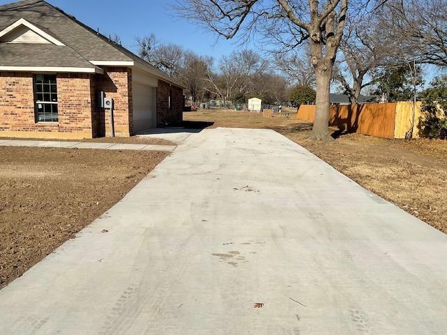 1203 Anthony Street Gainesville, TX 76240 - Photo 23 of 24 a view of road with large trees