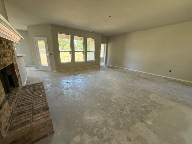 1203 Anthony Street Gainesville, TX 76240 - Photo 10 of 24 a view of an empty room with a fireplace and a window