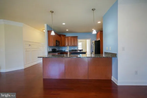 a bedroom with a bed and a ceiling fan