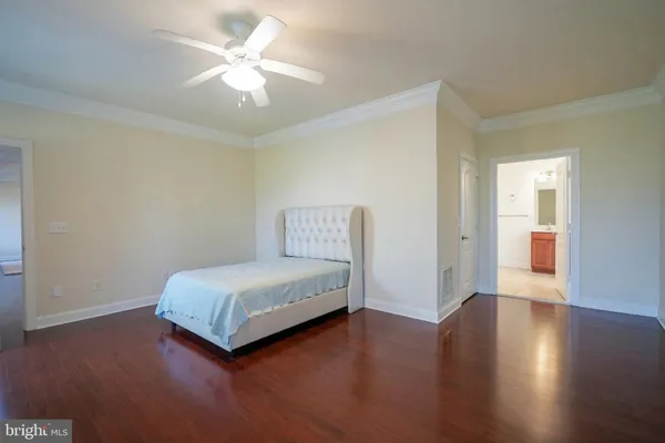 an empty room with a ceiling fan