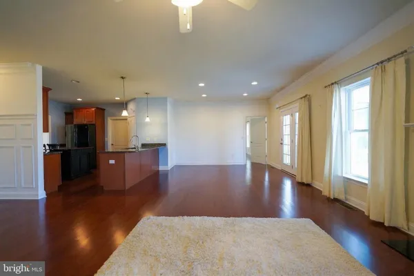 a kitchen with stainless steel appliances granite countertop a sink stove and microwave