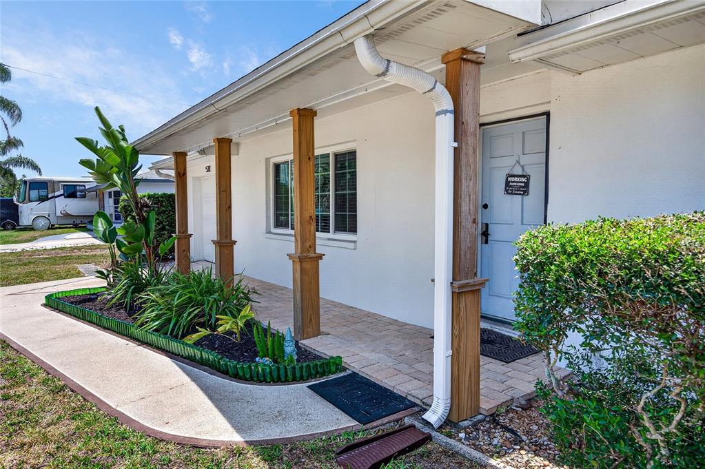 532 Center Road Venice, FL 34285 - Photo 13 of 68 a front view of a house with garden