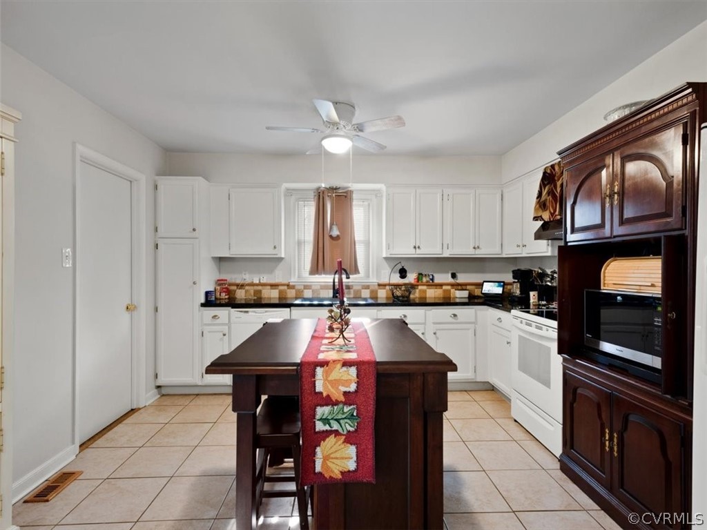 2601 Colgrave Road Midlothian, VA 23112 - Photo 7 of 21 a kitchen with stainless steel appliances granite countertop a stove and a refrigerator