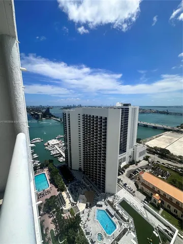 a view of a chairs and table in a backyard
