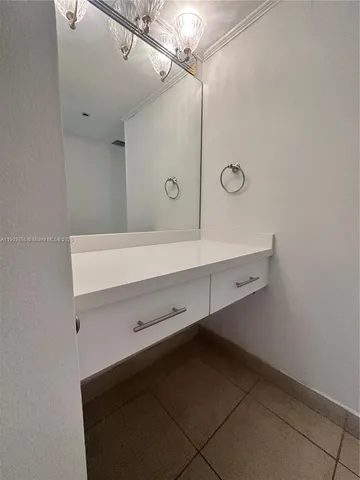 a bathroom with a sink a mirror and a shower