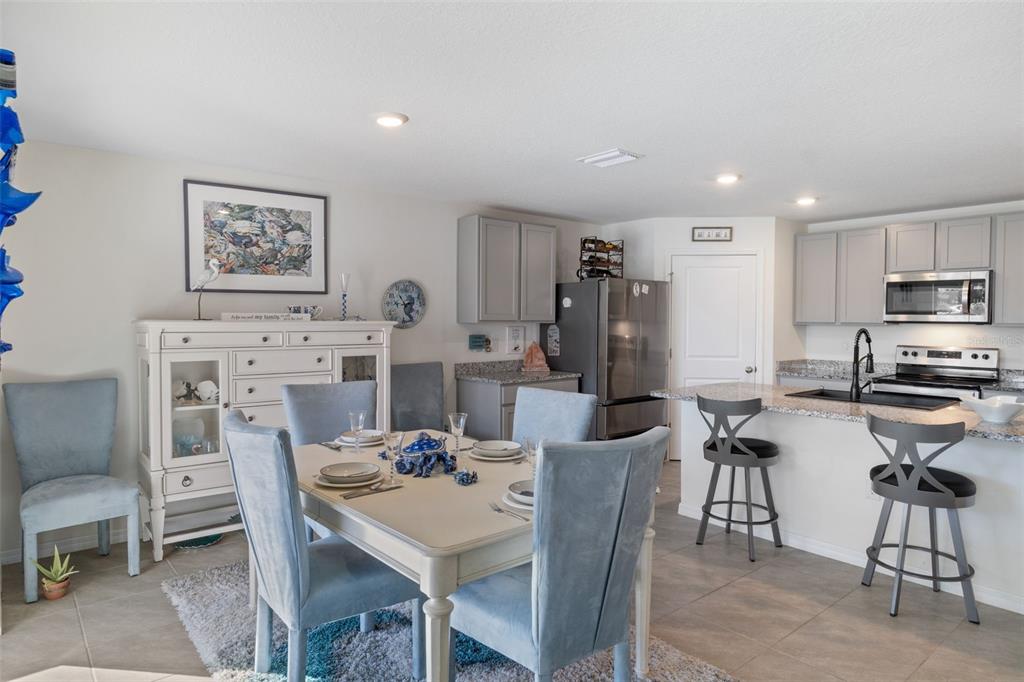 7514 Gardner Street Brooksville, FL 34613 - Photo 16 of 49 a view of a dining room with furniture