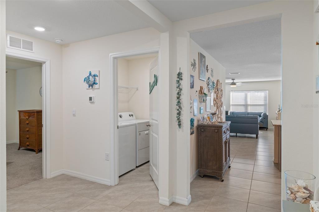 7514 Gardner Street Brooksville, FL 34613 - Photo 24 of 49 a view of a hallway with living room and furniture