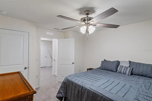 a bedroom with a bed and a baby