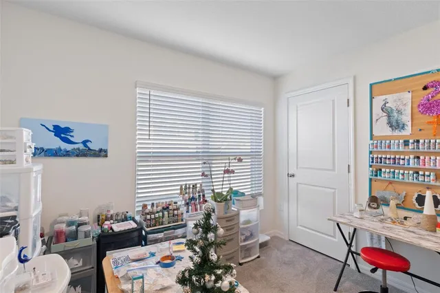 a bedroom with furniture and a window