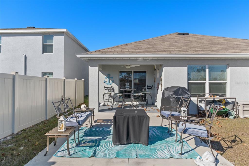 7514 Gardner Street Brooksville, FL 34613 - Photo 35 of 49 a front view of house with outdoor seating