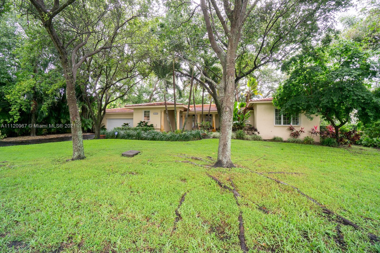 4423 Anderson Road Coral Gables, FL 33146 - Photo 1 of 18 a view of house with backyard