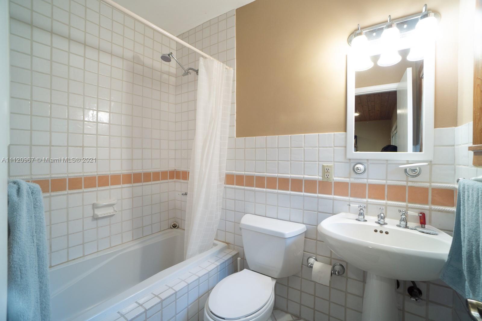 4423 Anderson Road Coral Gables, FL 33146 - Photo 11 of 18 a bathroom with a sink toilet and shower
