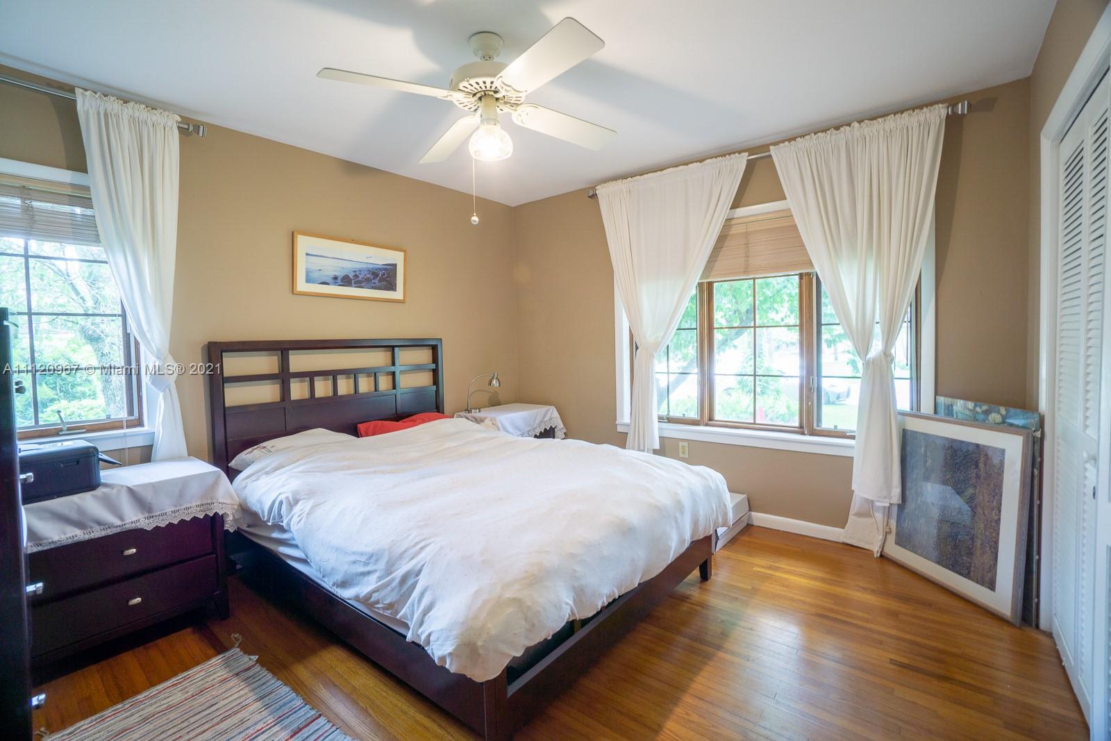 4423 Anderson Road Coral Gables, FL 33146 - Photo 12 of 18 a bedroom with a large bed and a window