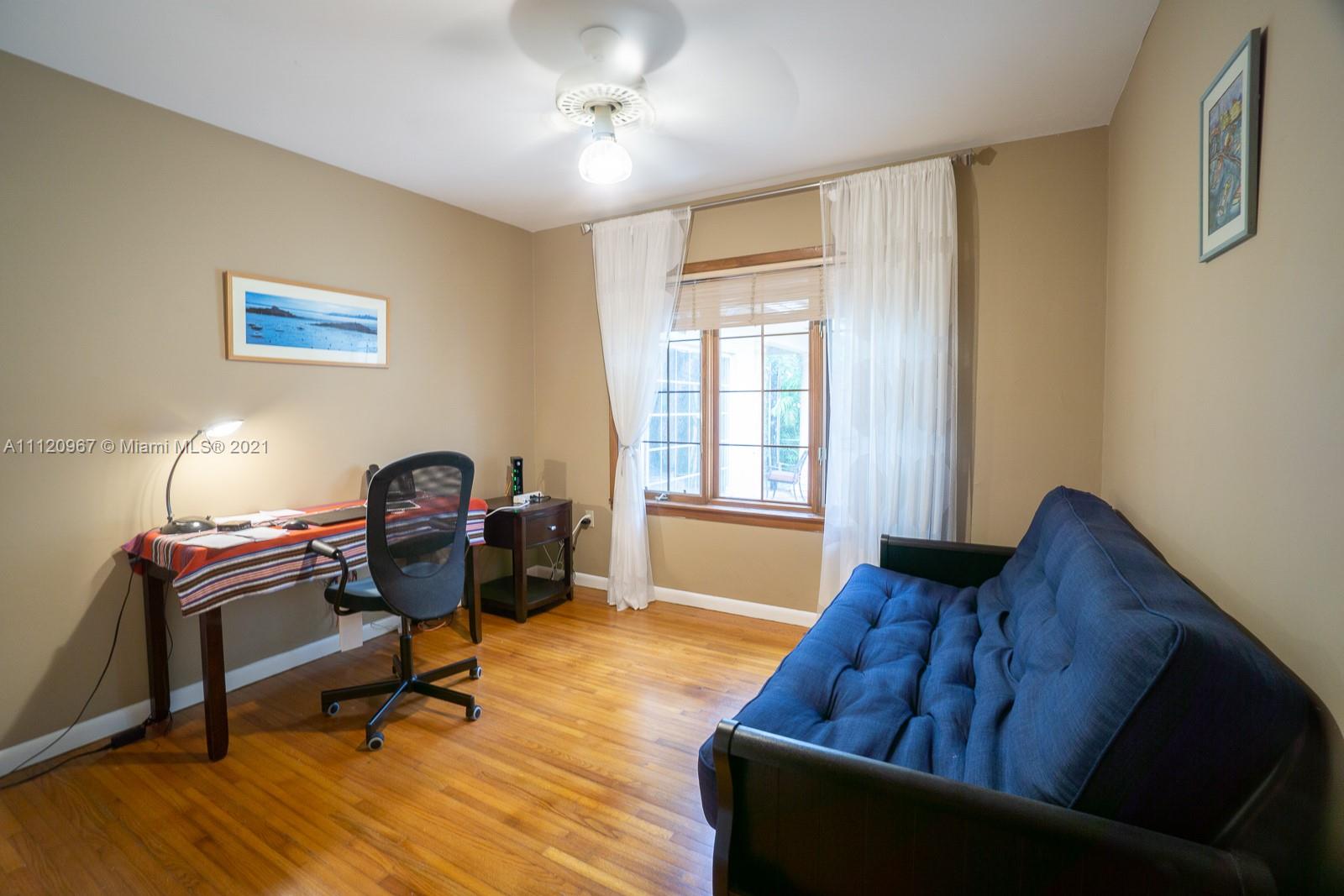 4423 Anderson Road Coral Gables, FL 33146 - Photo 13 of 18 a living room with furniture and a window