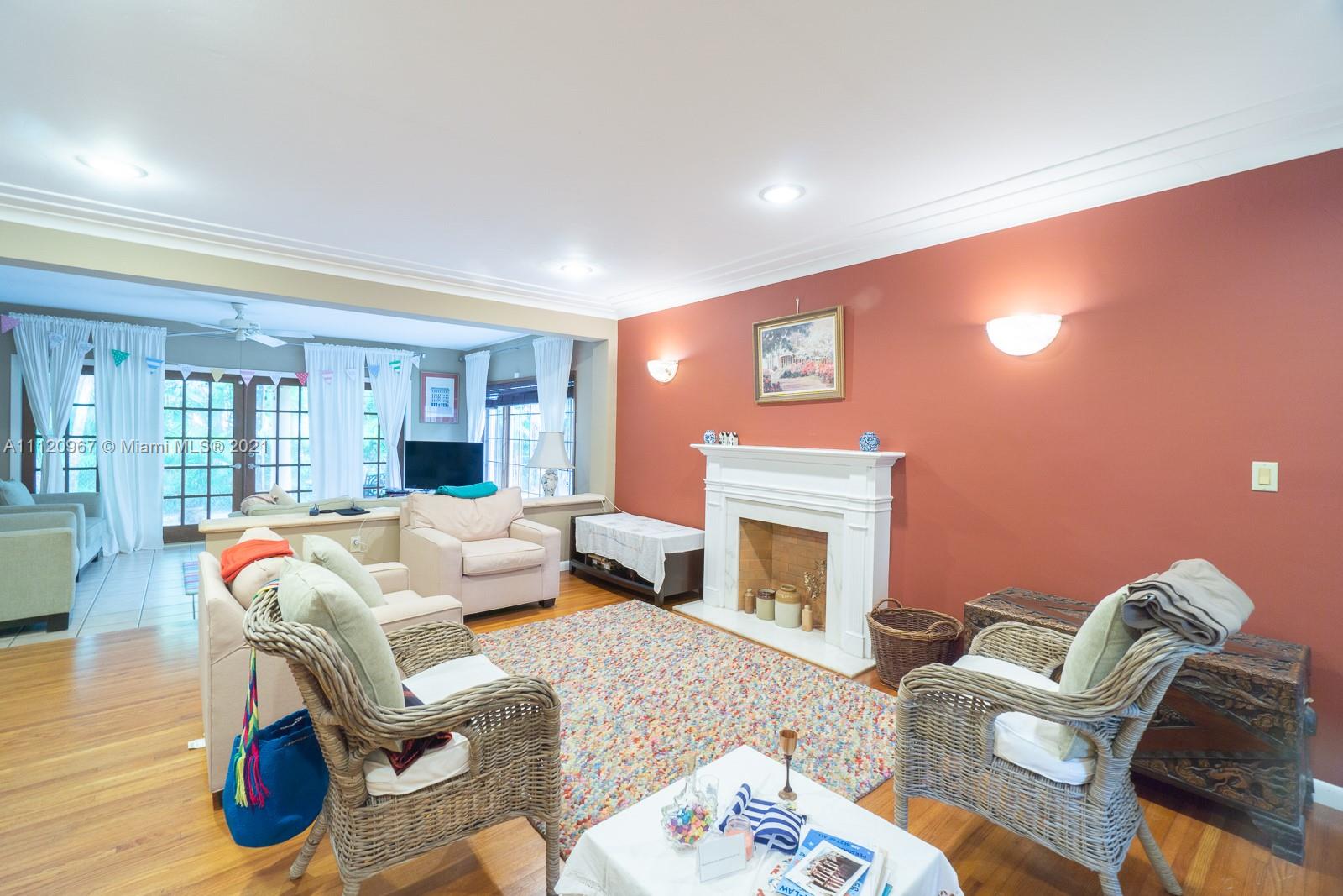 4423 Anderson Road Coral Gables, FL 33146 - Photo 3 of 18 a living room with furniture or couch and a fireplace