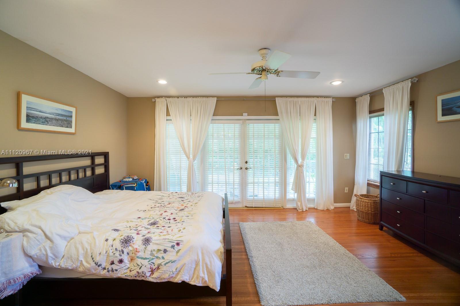 4423 Anderson Road Coral Gables, FL 33146 - Photo 8 of 18 a bedroom with a large bed and a large window