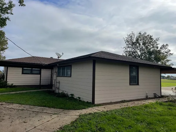 a backyard of a house with lots of green space