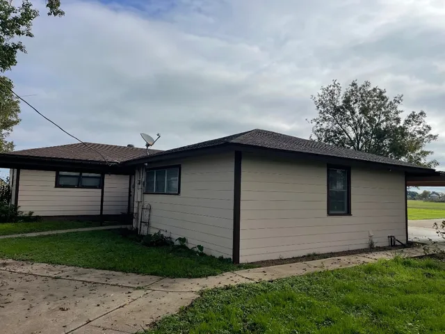 a backyard of a house with lots of green space
