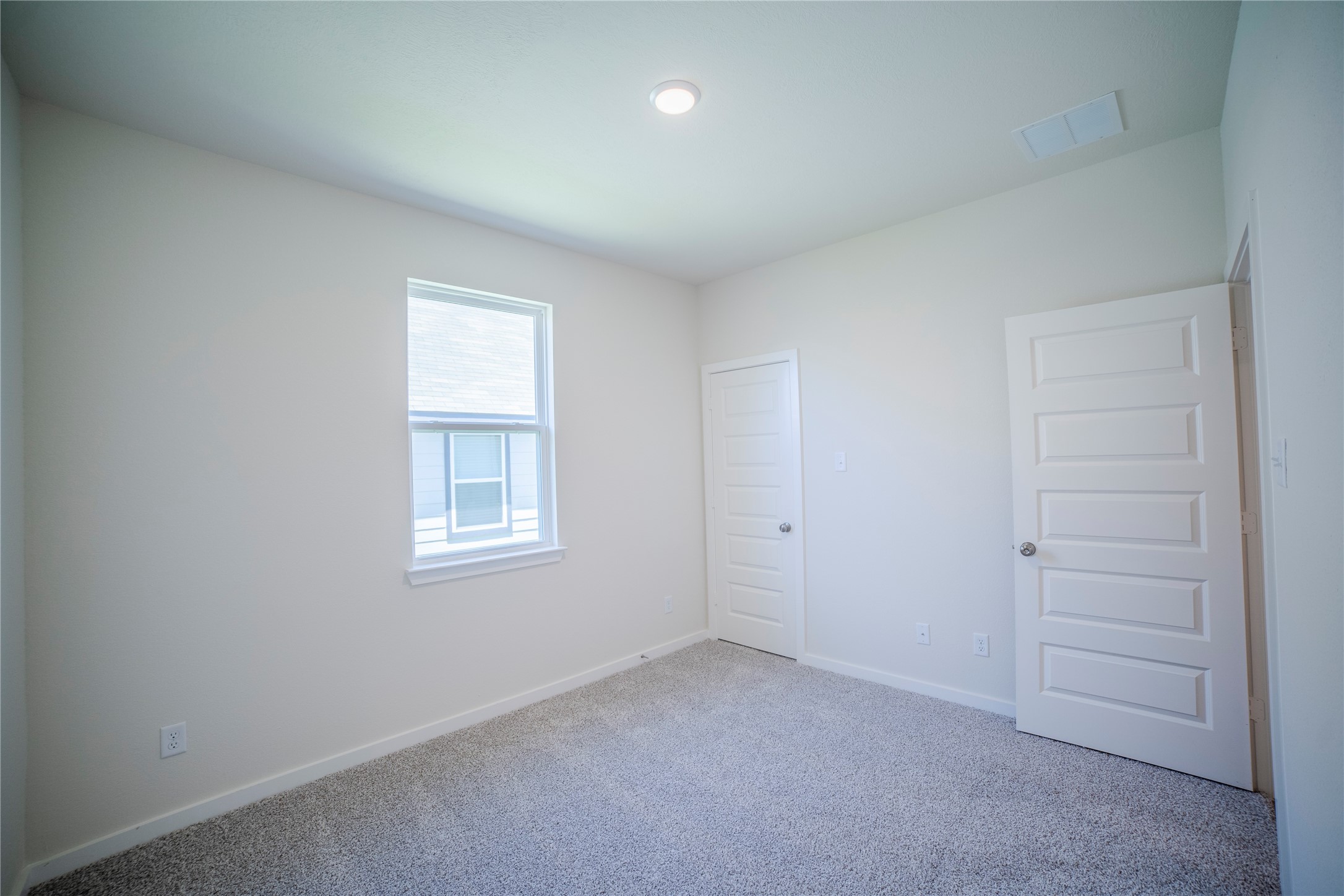 1402 Lk Rdg Drive Brenham, TX 77833 - Photo 15 of 35 an empty room with windows and closet