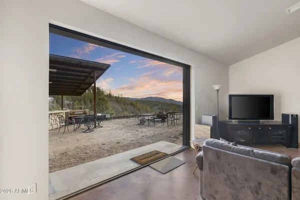 a bed room with a bed and a television