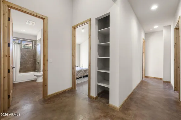 a bedroom with a bed and a table